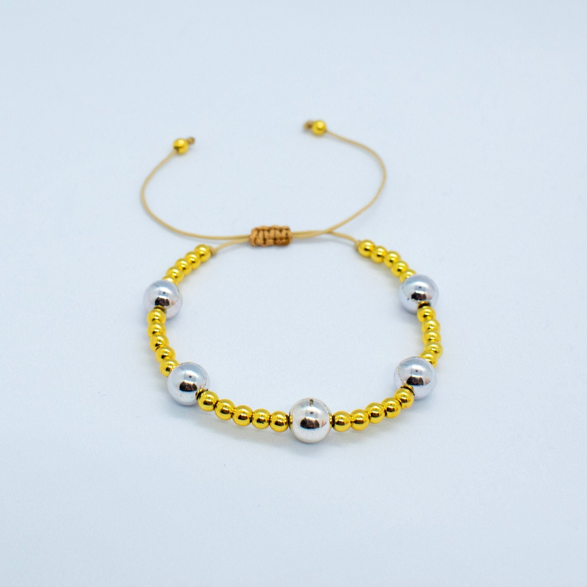 Silver and golden beads bracelet