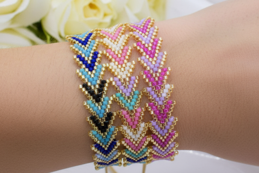AI arm wearing a colorful beaded bracelet on a wrist with a blurred floral background