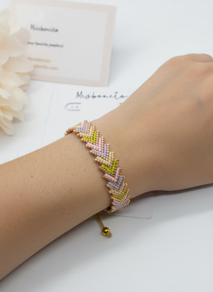 Ai models arm wearing an arrow bracelet 