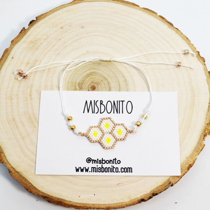 bee hive bracelet on a wood slice