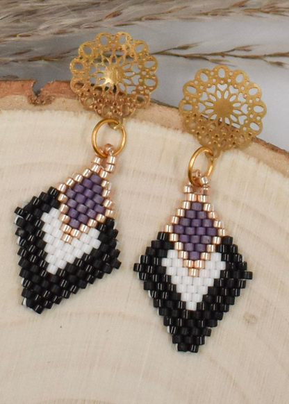 beaded earrings black and white diamond shaped on wood background
