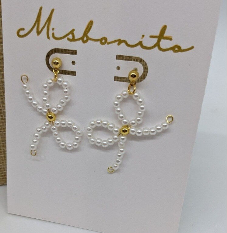 coquette earrings on a card