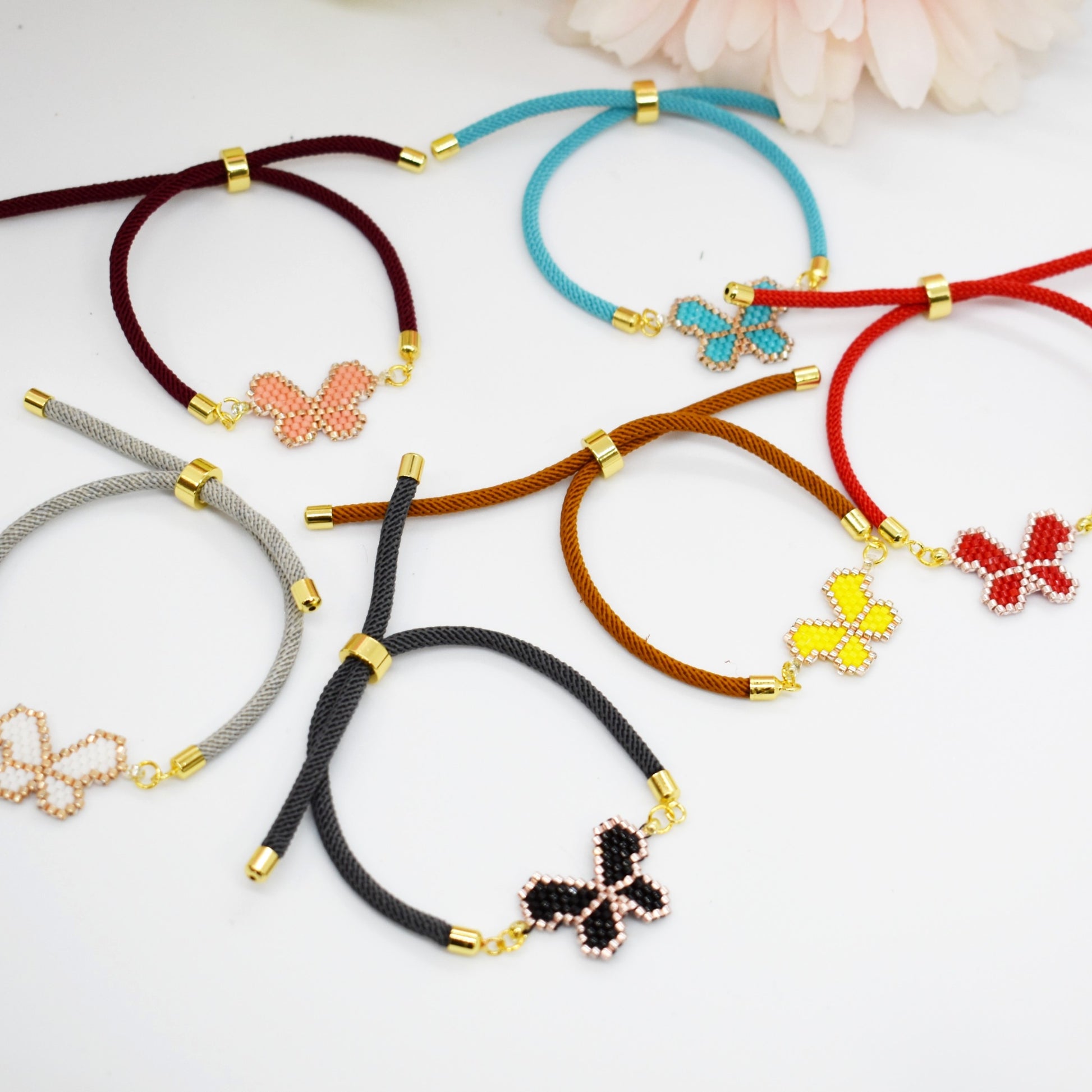 Beaded butetrfly cord bracelets