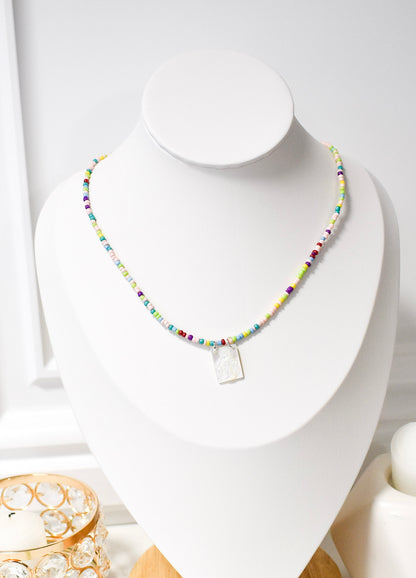 coloful white scapular on a bust