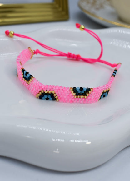evil eye bar bracelet pink bar on a white tray