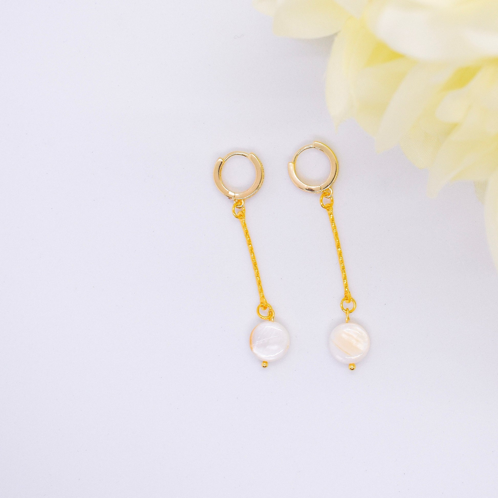 flat pearl earrings