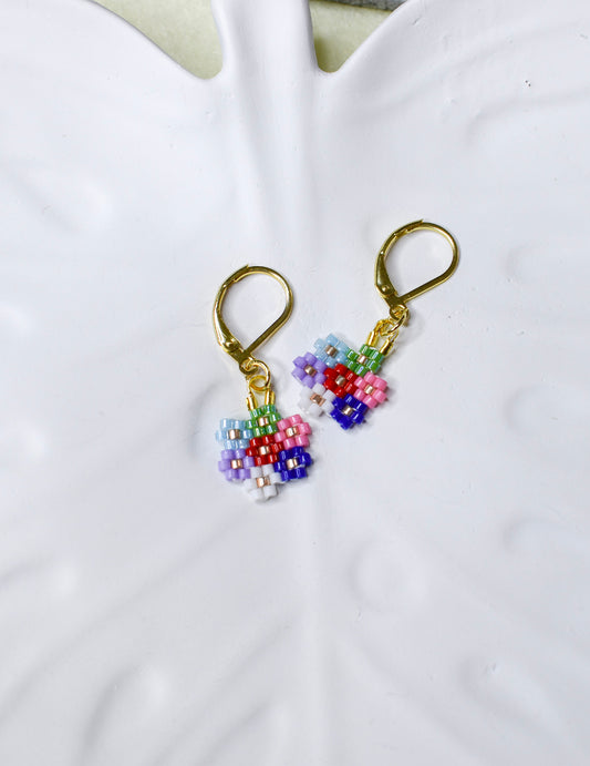 Colorful beaded earrings on a white background