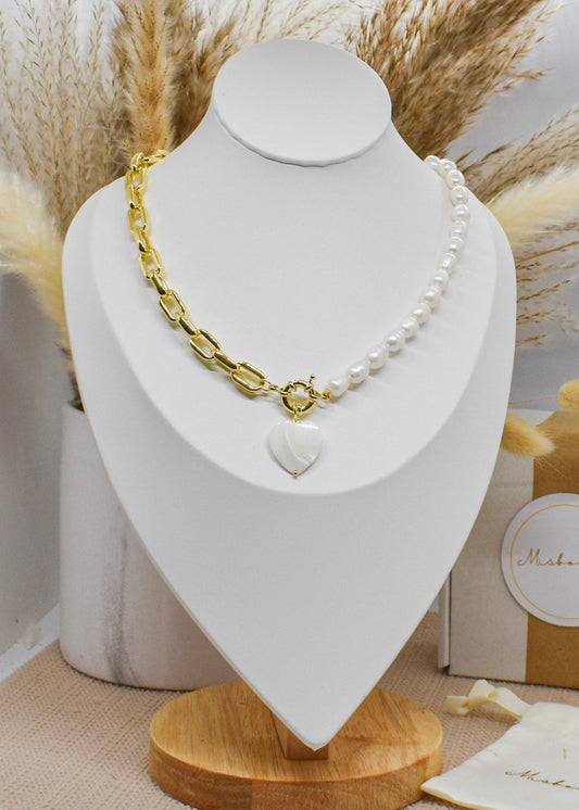 heart nacar chain necklace on a display