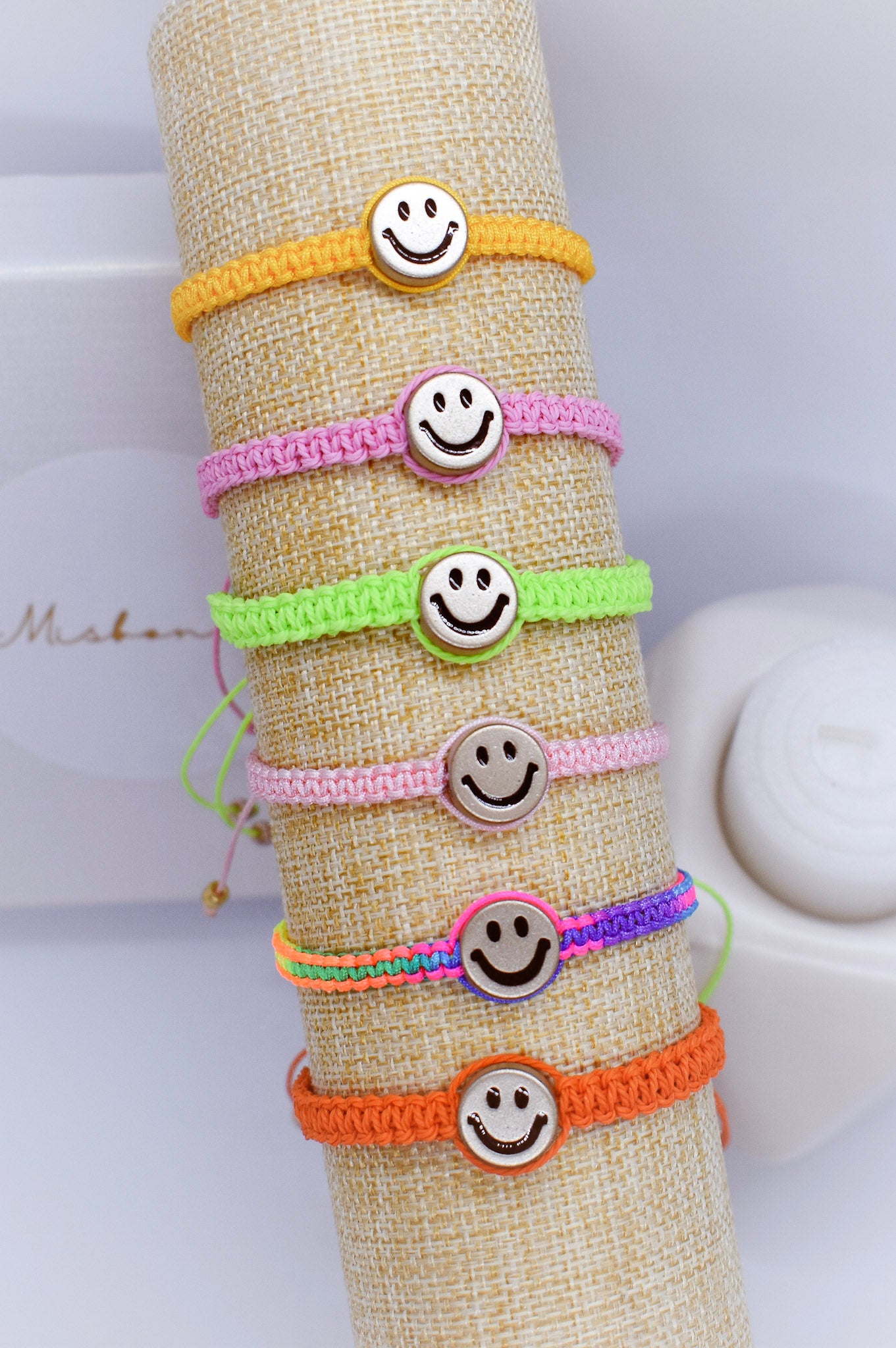 macrame Happy face bracelet on a tube