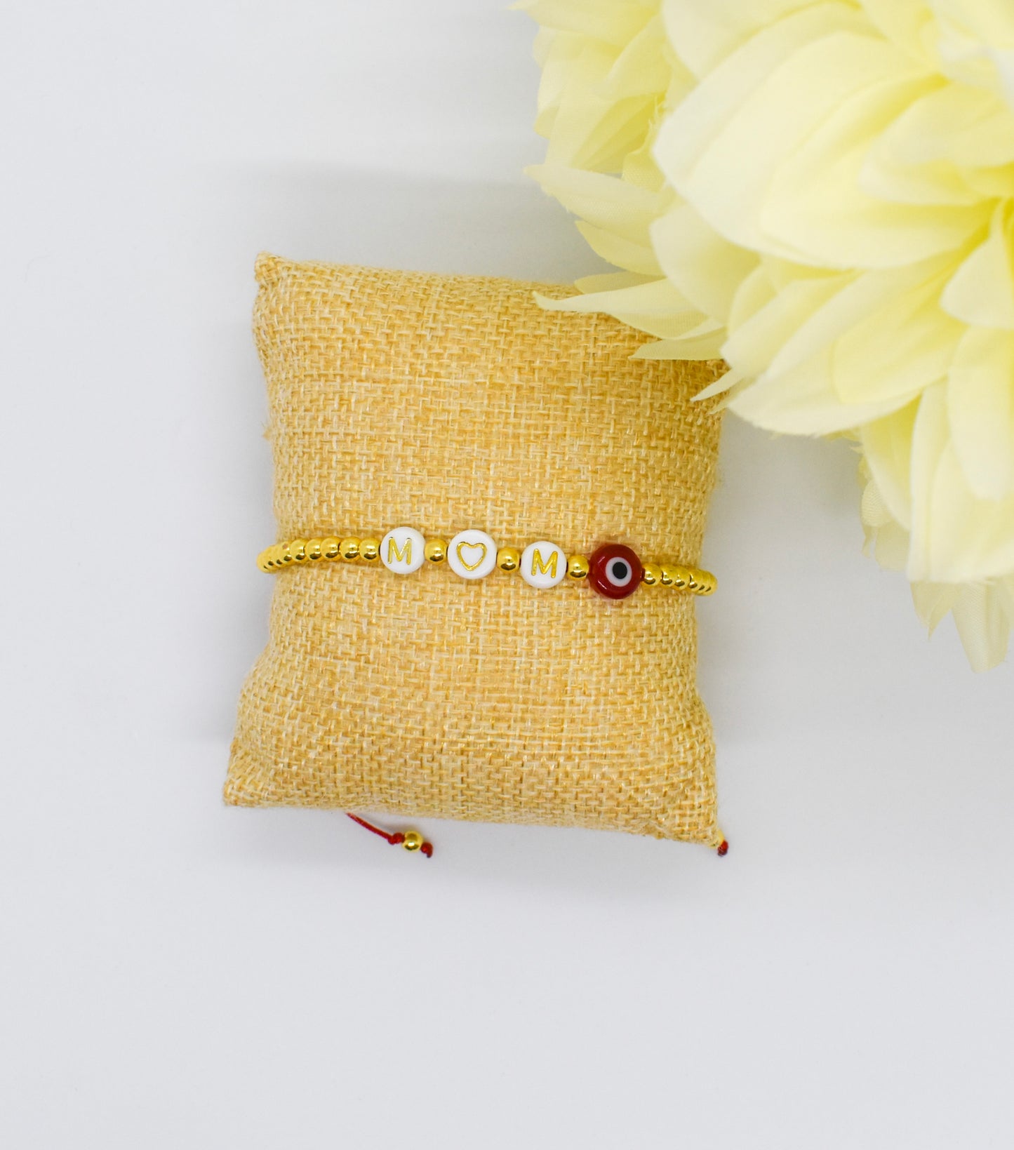 mom bracelet on a pillow