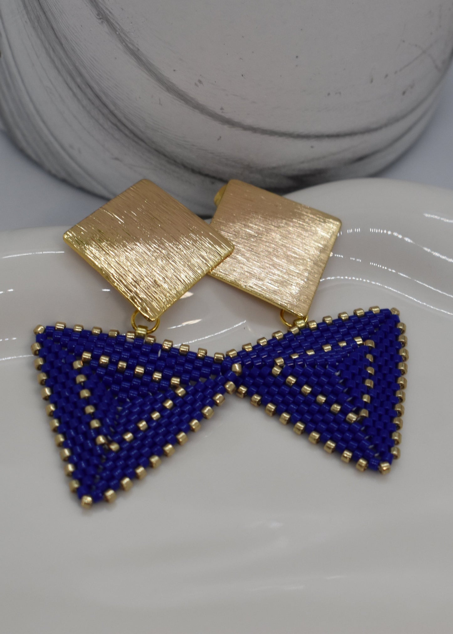 peyoteblue earrings on a tray