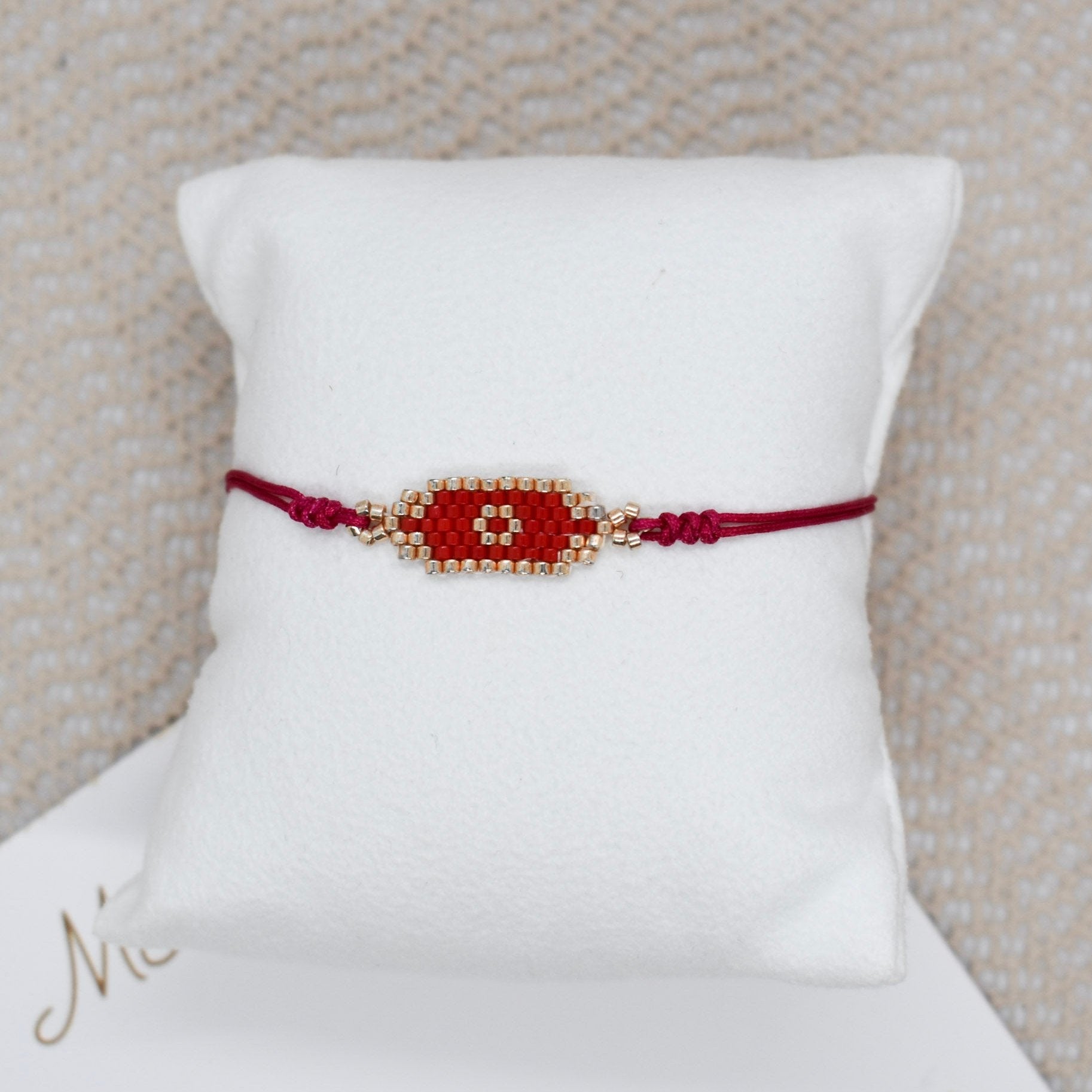 red small bar evil bracelet