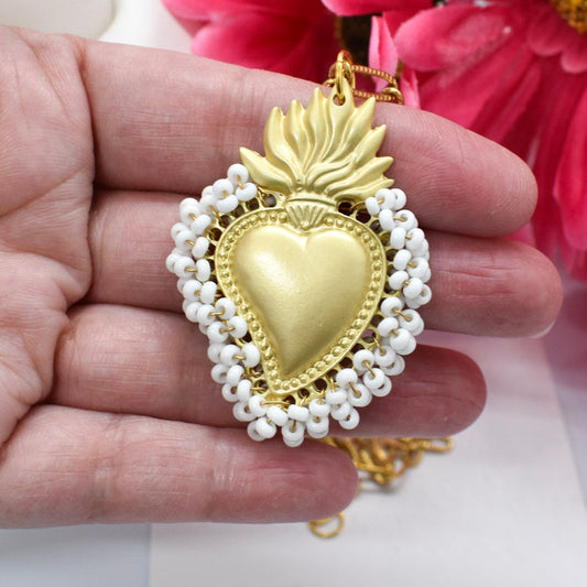 sacred heart of Jesus necklac on hand