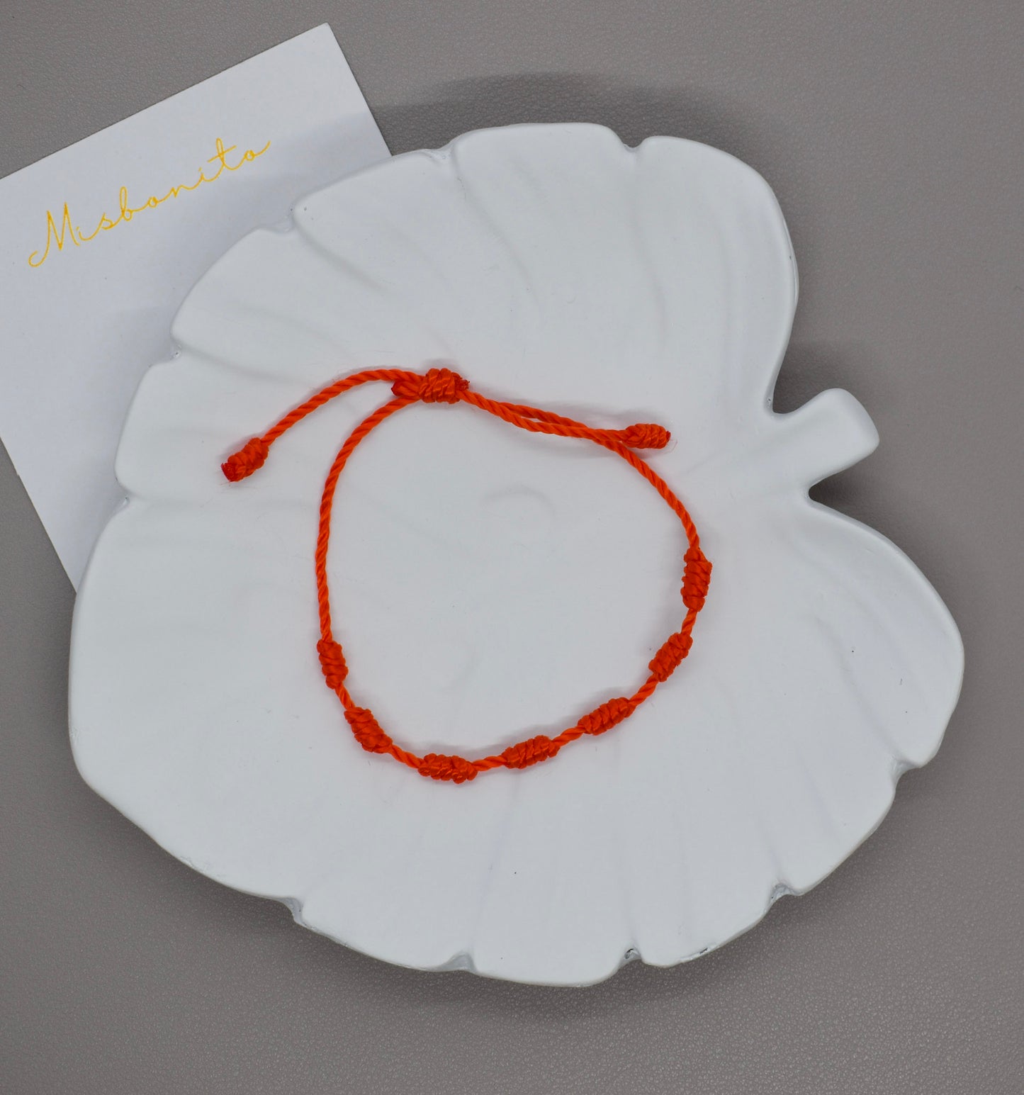 seven knots orange bracelet