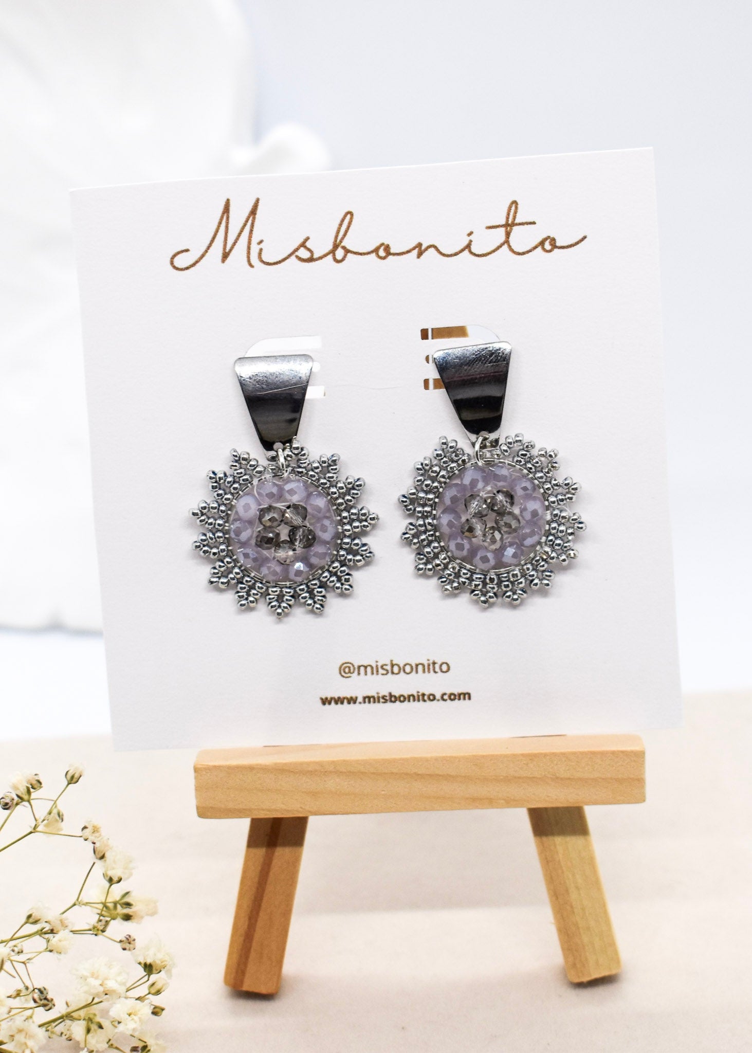 silver beaded earrings on a card