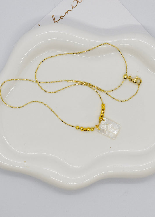 stainless steel adjustable scapular on a tray