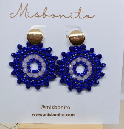 Blue beaded earrings on a Misbonito branded card.