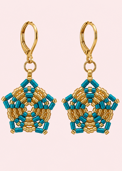 A pair of handmade beaded dangle earrings with gold-toned hooks and pentagonal star-shaped charms featuring turquoise and gold seed beads, displayed on a light gray background.
