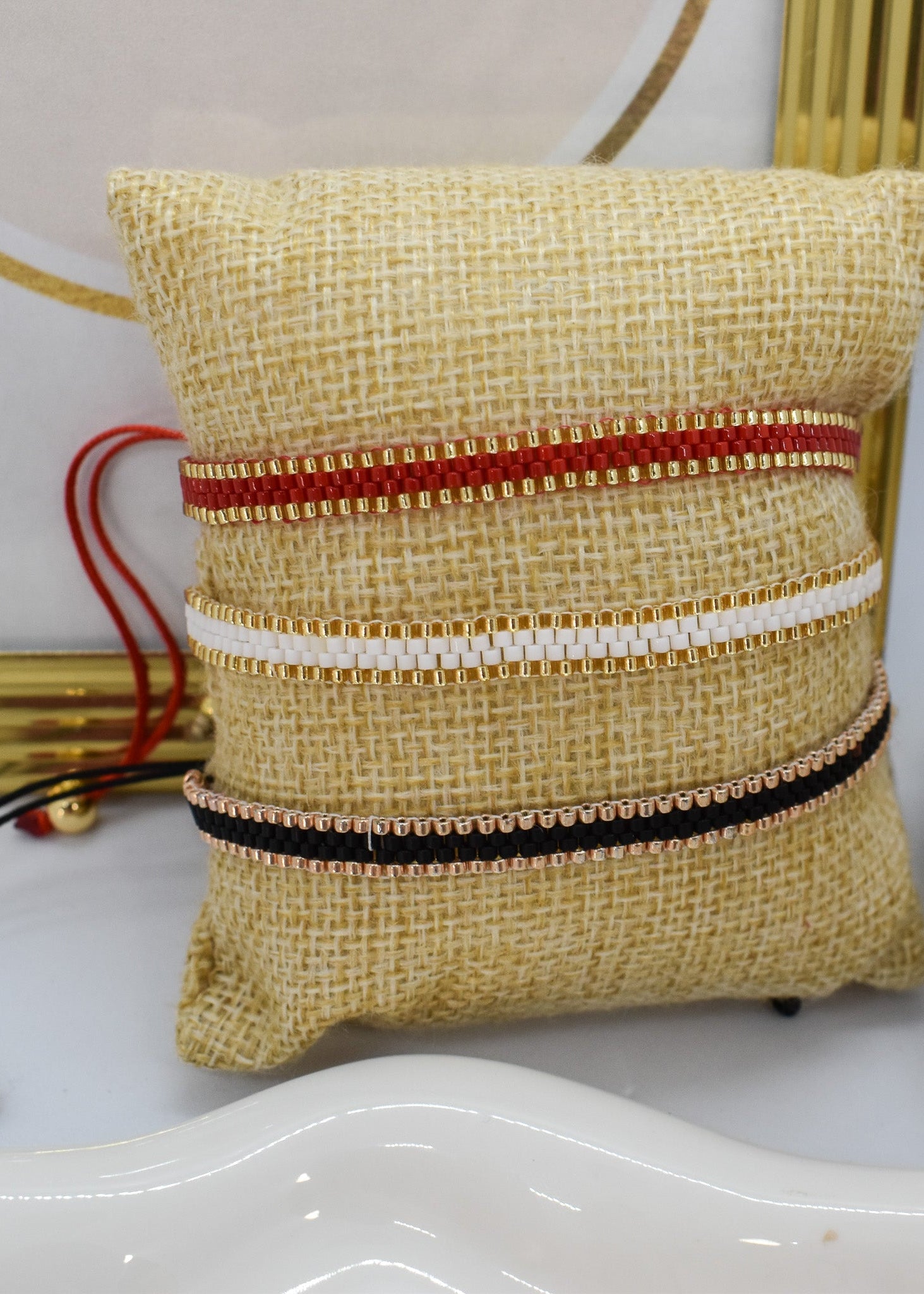 thin bracelets red white and black