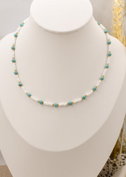 turquoise beaded necklace on a bust
