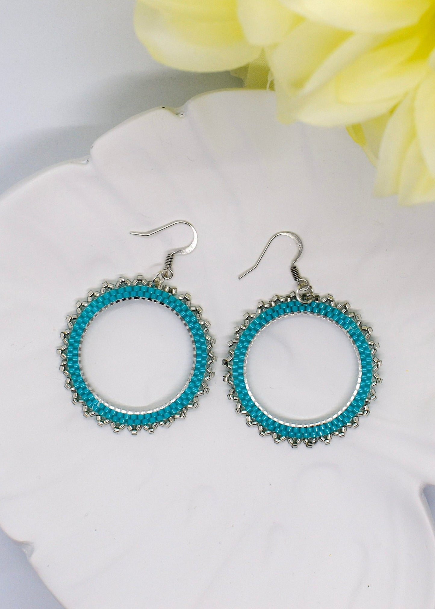 turquoise earrings on tray