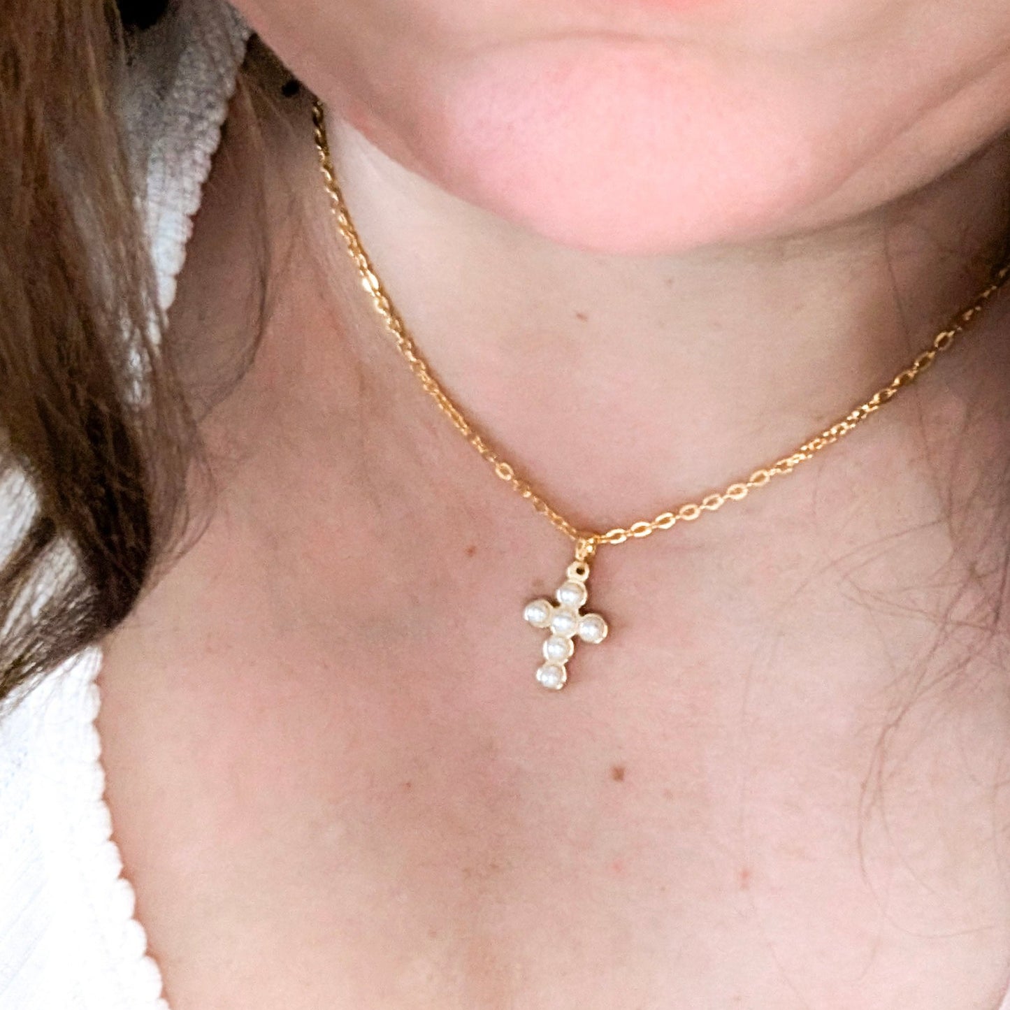 wearing cross necklace