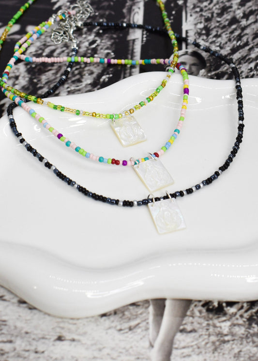whiteshell scapular necklaces