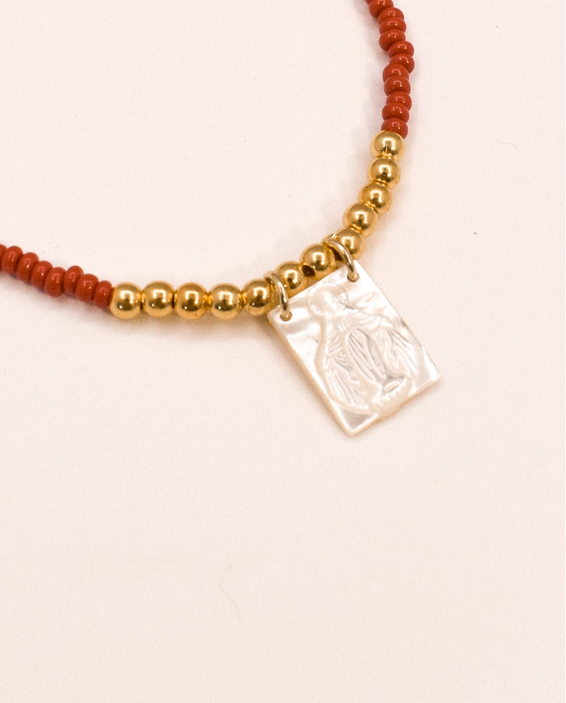 zoomed red scapular necklace