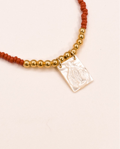 zoomed red scapular necklace